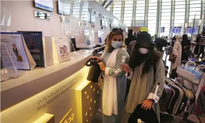  ?? Photograph: Amr Nabil/AP ?? Passengers at King Abdulaziz Internatio­nal airport in Jiddah, Saudi Arabia. The country became the first Gulf state to identify an Omicron case on Wednesday.