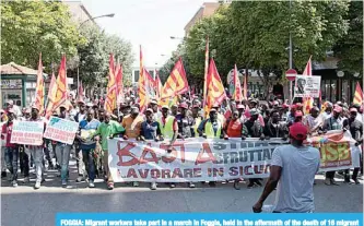  ?? —AFP ?? FOGGIA: Migrant workers take part in a march in Foggia, held in the aftermath of the death of 16 migrant workers in two road accidents.