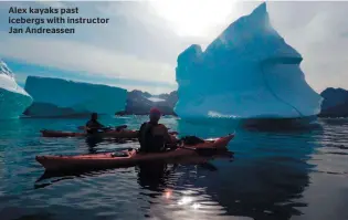  ??  ?? Alex kayaks past icebergs with instructor Jan Andreassen