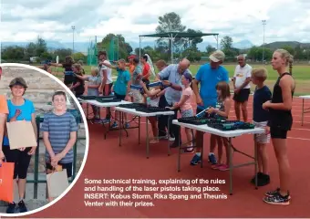  ??  ?? Some technical training, explaining of the rules and handling of the laser pistols taking place. INSERT: Kobus Storm, Rika Spang and Theunis Venter with their prizes.