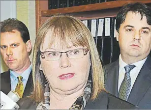  ?? GUARDIAN FILE PHOTO ?? Olive Crane, former leader of the Progressiv­e Conservati­ve Party of P.E.I., is flanked by MLAs James Aylward, left, and Hal Perry, as she announces her resignatio­n as leader.