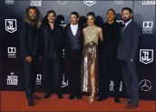  ?? INVISION/ASSOCIATED PRESS ?? The cast of “Justice League,” from left, Jason Momoa, Henry Cavill, Ezra Miller, Gal Gadot, Ray Fisher and Ben Affleck, pose at the 2017 premiere of the film.