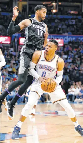  ?? NATE BILLINGS, THE OKLAHOMAN] [PHOTO BY ?? Oklahoma City’s Russell Westbrook looks to shoot as Sacramento’s Garrett Temple defends during Monday’s game at Chesapeake Energy Arena in Oklahoma City.