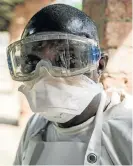  ?? /AFP ?? Necessary precaution­s: A health worker wears protective equipment as he looks on at Bikoro Hospital in Equateur province — the epicentre of the Ebola outbreak in the Democratic Republic of the Congo — on Saturday.