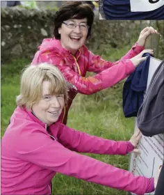  ??  ?? Margaret Kenna and Anne Marah stretching before the run.