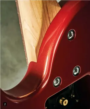  ??  ?? 2 1. The compact headstock houses basic, functional tuners while its back angle ensures a good break angle over the nicely cut graphite nut
2. This deep set bolt-on uses just three screws. It’s a very firm join and access right to the top of the 24-fret fingerboar­d is excellent