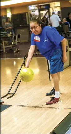  ?? VINCENT OSUNA PHOTO ?? Imperial Valley Special Olympics athlete Mary Jessie Jamarillo prepares to throw her ball down the lane during the annual Special Olympics Southern California Regional bowling tournament held Saturday at StrikeZone in El Centro.