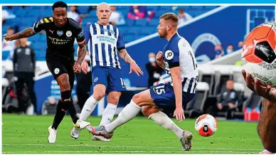  ??  ?? Three and easy: Sterling scores the first of his treble and claims the match ball