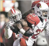  ?? MARCIO JOSE SANCHEZ - ASSOCIATED PRESS ?? The Cardinals’ Adrian Peterson runs by the 49ers’ Reuben Foster. Foster had 14 tackles in the 20-10 loss.