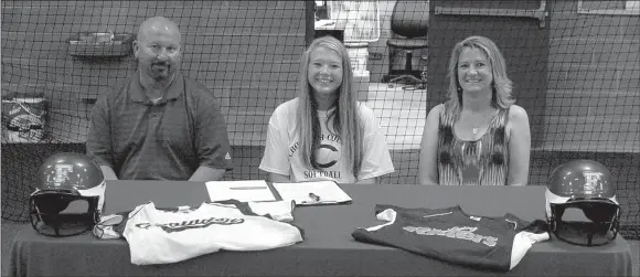  ?? MARK HUMPHREY ENTERPRISE-LEADER ?? Paige Purifoy (center) culminated her senior athletic career as a Farmington Lady Cardinal by accepting a scholarshi­p offer to play women’s college softball at Crowder College, of Neosho, Mo. She was flanked by her parents, Farmington High School...