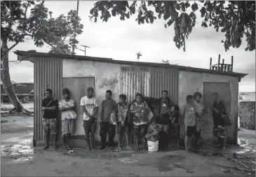  ??  ?? The harbour in Lorengau on Manus Island, Papua New Guinea, on November 10. Lorengau has become increasing­ly crowded with climate change refugees who have moved there from more remote islands, and now, refugees from the island’s detention centre are...