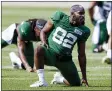  ?? MATT LUDTKE - THE ASSOCIATED PRESS ?? In this Aug. 18, 2021, file photo, New York Jets wide receiver Jamison Crowder stretches during a joint NFL football practice with the Green Bay Packers in Green Bay, Wis. Crowder is recovering from symptoms of COVID-19AND his status for the opening game at Carolina remains uncertain. Coach Robert Saleh said Monday,