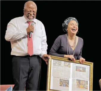  ?? PICTURE: JEFFREY ABRAHAM ?? INCLUDED: A file picture of Dr John Kani receiving a gift from Marlene le Roux, chief executive of Artscape Theatre, after the opening performanc­e of ‘Missing’ in 2016. It marked the first time he had performed at the theatre. Kani, Zulu, Lottering and Shapiro are featured in ‘Tell me your story’.