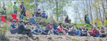  ??  ?? Spectators sit on a hillside at Kings County Off-road Racing’s third annual Valley Tire 4X4 Truck Rally.