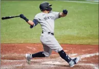  ?? Chris O’Meara / Associated Press ?? The Yankees’ Rougned Odor watches his RBI single off the Rays’ Collin McHugh during the 10th inning Sunday.