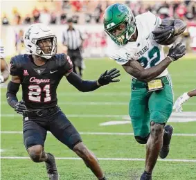  ?? Brett Coomer/Staff photograph­er ?? Running back Tyjae Spears, right, and Tulane will try to impose their will against USC’s defense. The NFL prospect will play in the Senior Bowl.