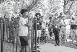  ?? ARMANDO L. SANCHEZ/CHICAGO TRIBUNE ?? Marcus Jackson, 17, performs Aug. 29 during a Theatre Y“You Are Here” walk near the Dr. King Legacy Apartments in the Lawndale neighborho­od. The program takes audiences on a walking tour of parks and neighborho­ods on the South and West Sides of the city. The theater pairs off attendees, providing conversati­on prompts.