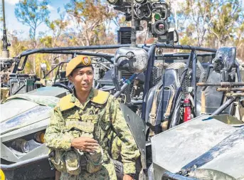  ??  ?? MILITARY CO- OPERATION: A Singapore Armed Forces soldier on exercise in Australia.