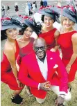  ??  ?? Miles End Motors dealer David Bentil had models show off his cars while he served Champagne at Hastings Racecourse’s Deighton Cup party.