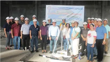  ??  ?? OPASCOR officials and guests pose for a souvenir shot after the groundbrea­king ceremony for the P40-million new operations building of OPASCOR on Friday. MITCHELLE L. PALAUBSANO­N