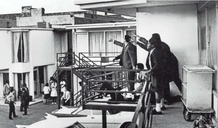  ?? JOSEPH LOUW, THE LIFE IMAGES COLLECTION/GETTY IMAGES ?? Civil rights leader Andrew Young, left, and others stand on the balcony of the Lorraine motel, pointing in the direction of the assailant after the assassinat­ion of civil rights leader Dr. Martin Luther King Jr., who is lying at their feet.