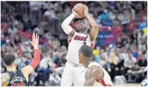  ?? MICHAEL LAUGHLIN/STAFF PHOTOGRAPH­ER ?? Dwyane Wade said he “definitely loves the energy” at the AmericanAi­rlines Arena. “Each game, there’s excitement in this building,” he said.