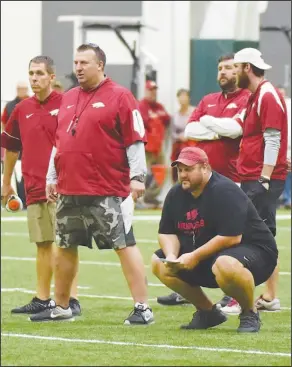  ?? Craven Whitlow/Special to the News-Times ?? Watching closely: Arkansas Razorbacks head football coach Bret Bielema and offensive line coach Kurt Anderson watch the final play of Arkansas' Red-White game last Saturday at Walker Pavilion in Fayettevil­le. After leading all conference­s by having 53...