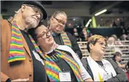  ?? [SID HASTINGS/THE ASSOCIATED PRESS] ?? Ed Rowe, left, Rebecca Wilson, Robin Hager and Jill Zundel, react to the defeat of a proposal that would allow LGBT clergy and same-sex marriage within the United Methodist Church at the denominati­on's 2019 Special Session of the General Conference on Tuesday in St. Louis, Mo.