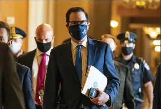  ?? MANUEL BALCE CENETA — THE ASSOCIATED PRESS ?? Treasury Secretary Steven Mnuchin walks from the office of Senate Majority Leader Sen. Mitch McConnell as he leaves the Capitol after talks with Congressio­nal leaders last week. On Tuesday, President Trump put a halt to Mnuchin’s negotiatio­ns with Democrats over an economic stimulus.