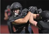  ?? DOUG DURAN — BAY AREA NEWS GROUP, FILE ?? Monte Vista High football player Josh Zeising takes part in a drill during practice on Feb. 26 in Danville.