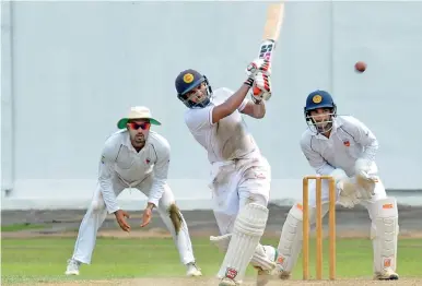  ??  ?? CCC's Lasith Abeyratne in action against SSC at Maitland Place, yesterday. Pic by Ranjith Perera