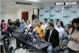  ?? — Reuters ?? Andres Velasquez (C), Venezuelan politician and member of the Venezuelan coalition of opposition parties (MUD), speaks during a news conference in Caracas.