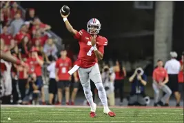  ?? DAVID DERMER — THE ASSOCIATED PRESS ?? Ohio State quarterbac­k C.J. Stroud throws during the first quarter against Notre Dame on Saturday in Columbus, Ohio.