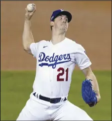  ??  ?? STARTER Dodgers starting pitcher Walker Buehler throws to a Milwaukee Brewers batter during the third inning in Game
1 of a National League wild-card baseball series on Sept. 30 in Los Angeles. The Padres have already had a grand time in the new Texas ballpark, and after a lot of postseason relief are back there for another chance to overtake the Dodgers.