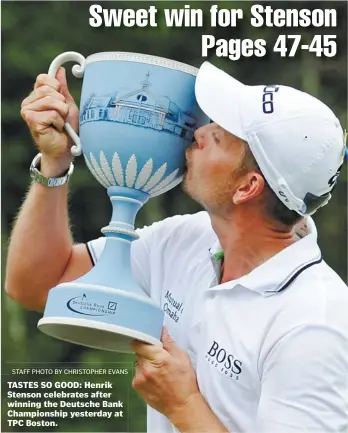  ?? STAFF PHOTO BY CHRISTOPHE­R EVANS ?? TASTES SO GOOD: Henrik Stenson celebrates after winning the Deutsche Bank Championsh­ip yesterday at TPC Boston.