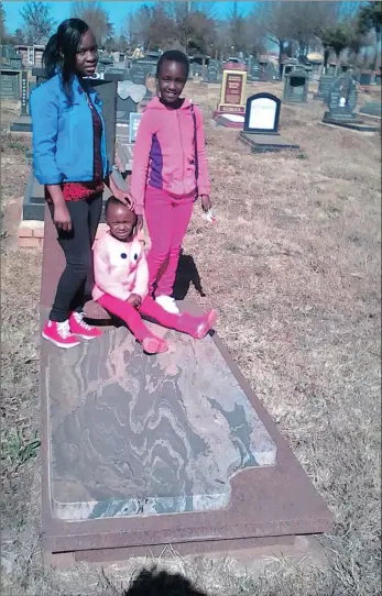  ??  ?? Pule Makgale’s daughters, Rethabile, left, Naledi and Gontse, continue to visit their grandmothe­r’s grave, even though the headstone was stolen. The theft has left the family angry and devastated.