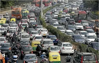  ?? PHOTO: BLOOMBERG ?? Traffic moves along a highway during morning rush hour in Delhi. Many of the small vehicles on the highway have a zero star safety rating.