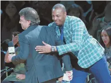  ?? STAFF PHOTO BY MATT WEST ?? BACK AT YOU: Paul Pierce gives Celts owner Wyc Grousbeck a hug during last night’s ceremony.