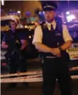  ?? DANIEL LEAL-OLIVAS/AFP/GETTY IMAGES ?? Police guard a street in the Finsbury Park area of north London where a vehichle hit pedestrian­s on Sunday night.