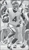  ?? Luis Sinco Los Angeles Times ?? ELLISON returns a punt during USC’s game at Virginia in 2008. He had a short NFL career with the Chargers.