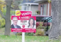  ??  ?? A sold sign on the lawn of a home on the West Island of Montreal last week. Single family homes sold in Montreal last month were on the market on average for 78 days, almost two weeks less than a year ago.