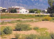  ?? ROSALIE RAYBURN/JOURNAL ?? A portion of the north nine holes of the then-named Chamisa Hills golf course is seen from Pinnacle Drive in Rio Rancho in 2013. The facility has become a blight to the community, according to columnists Mike and Genie Ryan, since closing late last year.