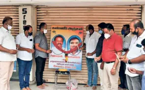  ??  ?? MOBILE shop owners paying tributes to the father and son who died in custody, in Salem on June 24. (Right) CPI(M) cadres protesting against the custodial deaths.