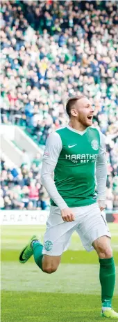  ??  ?? Hibs captain David Gray celebrates after rounding off the scoring to seal his side’s Premiershi­p return