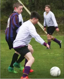  ??  ?? Tommy Convey (Wexford Albion) shields the ball from Cian O’Rourke.