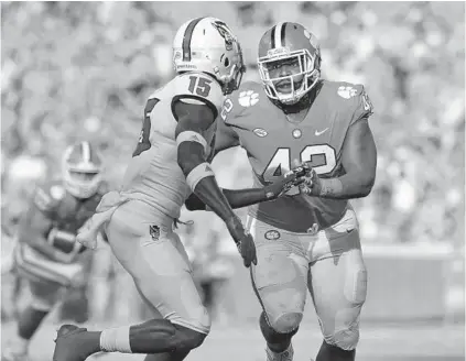  ??  ?? Clemson’s Christian Wilkins goes against North Carolina State’s Chris Ingram during a game earlier this season.