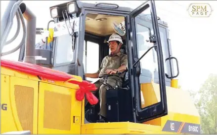  ?? HUN SEN’S FACEBOOK PAGE ?? Prime Minister Hun Sen operates a bulldozer at Monday’s Third Ring Road groundbrea­king ceremony. He said the road will play an important role in promoting national economic growth and bring convenienc­e for the people.