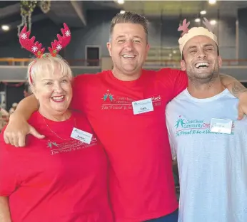  ?? ?? Susie Longman, Cam Christie and volunteer Ryan Fawzi at this year’s Gold Coast Community Christmas lunch in Labrador; and (below) Member for Bonney Sam O’Connor volunteeri­ng at the lunch. Pictures: Ashleigh Jansen