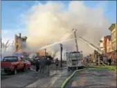  ??  ?? More than 30 buildings were damaged or destroyed by a massive Nov. 20, 2017, fire in the Remsen Street area of downtown Cohoes. RECORD FILE PHOTO