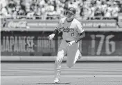  ?? KYODO NEWS USA TODAY NETWORK ?? The Dodgers’ Shohei Ohtani rounds the bases Sunday after hitting a two-run home run against the Mets.